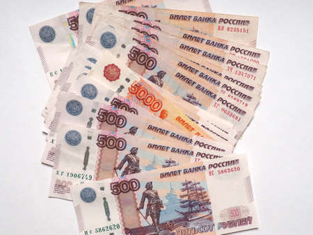 Russian five thousand ruble bill peeking out from a pile of five hundred ruble banknotesの写真素材