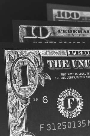 US banknotes of 1, 10 and 100 dollars. Close-up denomination figures. American economy, exchange...