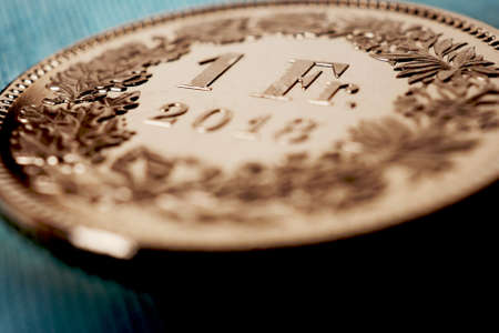 One Swiss franc coin close-up. Catchy illustration about the economy, business, money and finance of Switzerland. Central bank, banking secrecy, national currency and capital export. Macroの写真素材