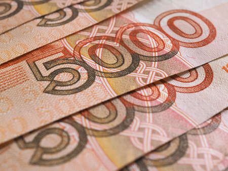 Russian banknotes 5000 rubles close-up. Fragment of a bill with a focus on the denomination figure. Illustration about money. Banking economy currency in Russia. Macroの写真素材