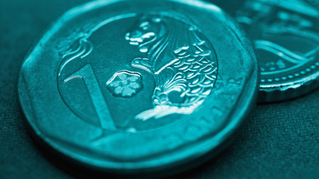 1 Singapore dollar. Fragment of textured coin. Turquoise tinted background or wallpaper about economy or finance. Coins and money change of Singapore. News about banks and currency. Macroの写真素材