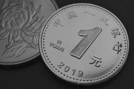 1 one Chinese yuan coin close-up. Dark gray and black background or wallpaper. Economy, business, money and finance of the China. News about PRC. Yuan of the new sample of 2019. Macroの写真素材