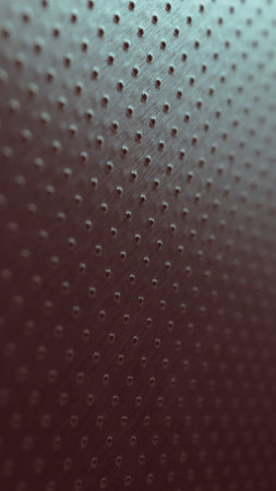 Perforated aluminum surface with many holes. Dark vertical phone wallpaper. Tinted red and green industrial metal background. Macroの写真素材