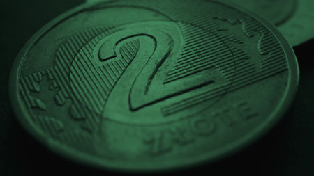 Translation: 2 zloty. Fragment of Polish two zloty coin close-up. National currency of Poland. Dark green tinted background for news about economy or finance. polish money. Macroの写真素材