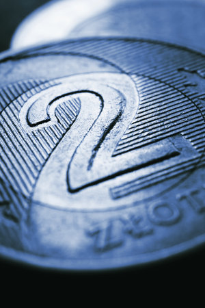 Translation: 2 zloty. Fragment of Polish two zloty coin closeup. National currency of Poland. Dark...
