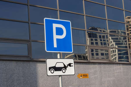 Parking for electric cars, for example Tesla with corresponding signs. Inscription Observation deck in Russian. Modernization of the city. Minsk, Belarus - 26 October 2019, Illustrative Editorialの写真素材