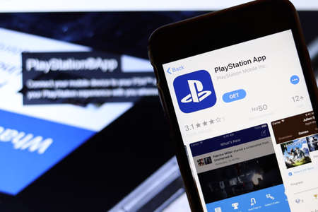 Los Angeles, California, USA - 26 November 2019: PlayStation App icon on phone screen with logo on...