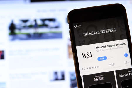 Los Angeles, California, USA - 26 November 2019: The Wall Street Journal icon on phone screen with logo on blurry background, Illustrative Editorial.のeditorial素材