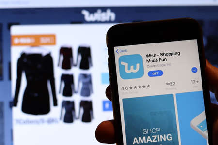 Los Angeles, California, USA - 26 November 2019: Wish app icon on phone screen with logo on blurry background, Illustrative Editorial.のeditorial素材