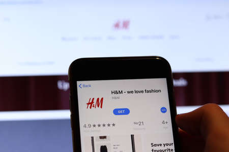 Los Angeles, California, USA - 26 November 2019: HM icon on phone screen with logo on blurry background, Illustrative Editorial.のeditorial素材