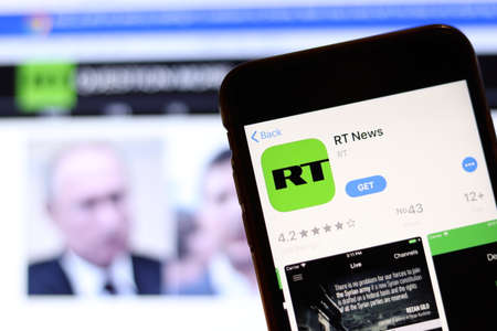 Los Angeles, California, USA - 26 November 2019: RT News app icon on phone screen with logo on blurry background, Illustrative Editorial.のeditorial素材