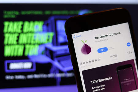 Los Angeles, California, USA - 26 November 2019: Tor Onion Browser icon on phone screen with logo on blurry background, Illustrative Editorial.のeditorial素材