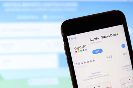 Los Angeles, California, USA - 26 November 2019: Agoda app icon on phone screen with logo on blurry background, Illustrative Editorial.のeditorial素材