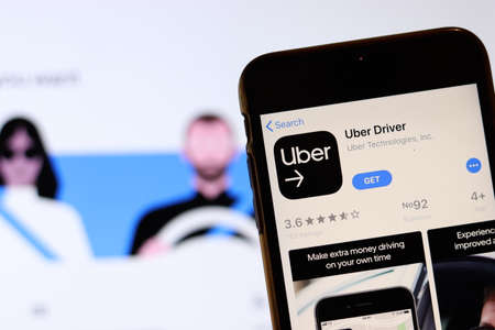 Los Angeles, California, USA - 26 November 2019: Uber Driver icon on phone screen with logo on...