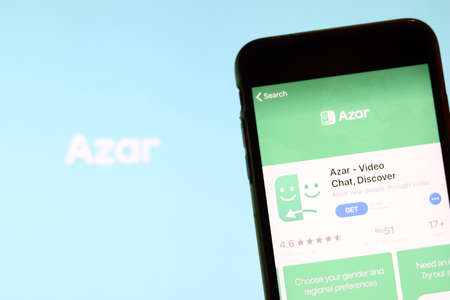 Los Angeles, California, USA - 27 November 2019: Azar app icon on mobile phone screen with blurry...