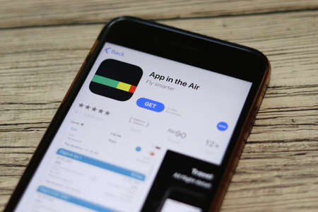 Phone with App in the Air logo on screen top view close-up. Los Angeles, California, USA - 9 November 2019, Illustrative Editorial.のeditorial素材