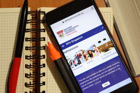 Los Angeles, California, USA - 7 December 2019: Phone screen with Nanyang Technological University, Singapore NTU website page top view. Higher education admission concept, Illustrative Editorial.のeditorial素材