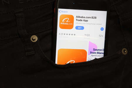 Saint-Petersburg, Russia - 6 December 2019: Mobile phone screen with Alibaba Trade app icon in pocket close-up, Illustrative Editorial.のeditorial素材