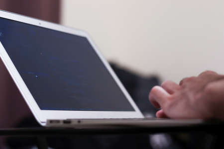 Work on laptop at home. Hands on the keyboard close-up. Copy space.の写真素材