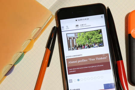 Los Angeles, California, USA - 7 December 2019: Mobile phone screen with Kyoto University website page close-up. Higher education admission and overview concept, Illustrative Editorialのeditorial素材