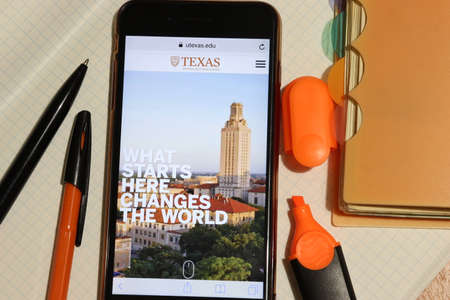 Los Angeles, California, USA - 7 December 2019: Mobile phone screen with University of Texas at Austin website page close-up. Higher education admission and overview concept, Illustrative Editorial.のeditorial素材