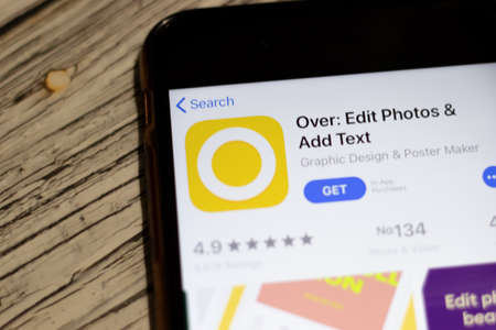 Saint-Petersburg, Russia - 25 December 2019: Over icon on App Store page close up top view on phone screen, Illustrative Editorial.のeditorial素材