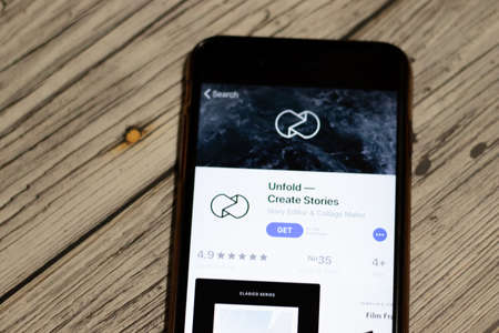 Saint-Petersburg, Russia - 25 December 2019: Unfold icon on App Store page close up top view on phone screen, Illustrative Editorial.のeditorial素材