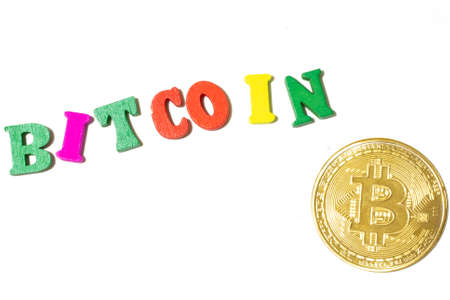 Word bitcoin made with letterboard and coin on white background top view.の写真素材
