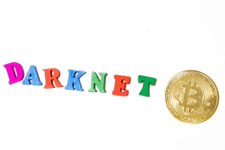 Darknet and bitcoin concept. Word and cryptocurrency coin on white background top view.の写真素材