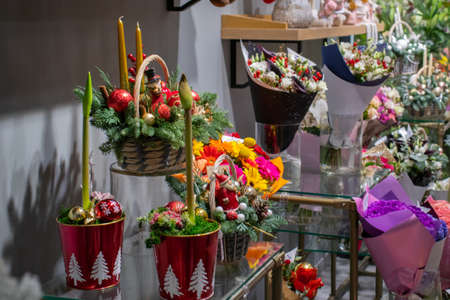 Flowers in Christmas pots. Inside Flower Shop.の写真素材