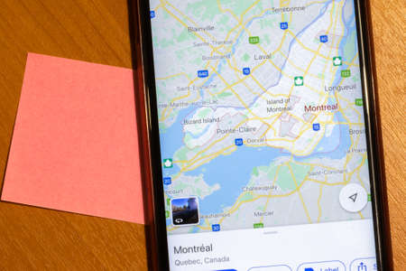 Map of Montreal city on phone screen close-up top view with copy space.の写真素材