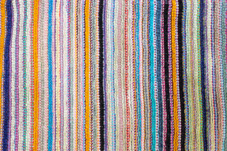 Multicolored vertical bright strips of woven material. Copy space background.の写真素材