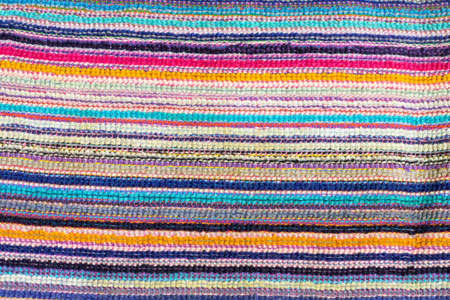 Multicolored horizontal bright strips of woven material. Background texture with copy space.の写真素材
