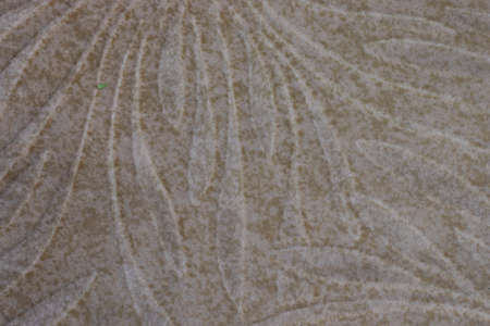 Bright beige texture with a pattern. Background with copy space.