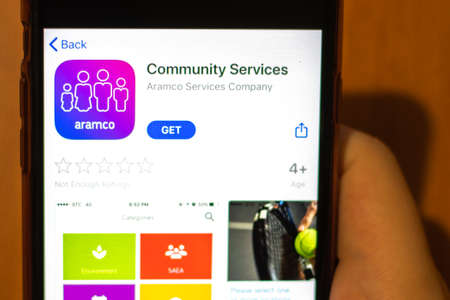 Los Angeles, California, USA - 17 January 2020: Mobile phone in hand with Community Services app logo on screen close-up, Illustrative Editorial.のeditorial素材