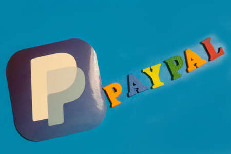 Los Angeles, California, USA - 25 January 2020: Paypal logo app on blue background, Illustrative...