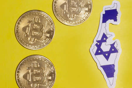 Israel Flag with Bitcoin flat lay for illustration. Cryptocurrency btc law concept.の写真素材