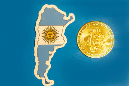Argentina Flag with Bitcoin flat lay for illustration. Cryptocurrency btc law concept.