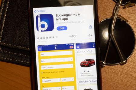 Los Angeles, California, USA - 12 February 2020: Bookingcar car rental App Store page close up , Illustrative Editorial.のeditorial素材