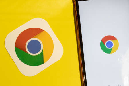 Los Angeles, California, USA - 12 February 2020: Google Chrome app logo and phone with icon close up , Illustrative Editorial.のeditorial素材
