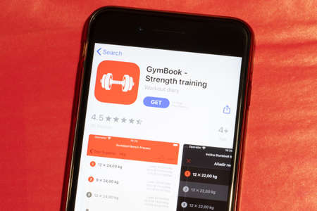 Los Angeles, California, USA - 12 February 2020: GymBook app icon on phone screen top view, Illustrative Editorial.のeditorial素材