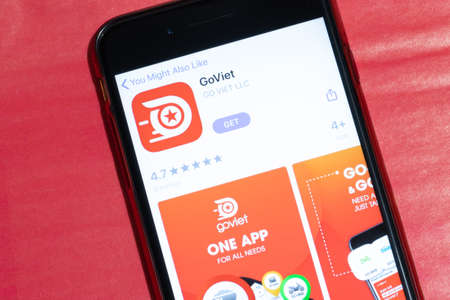 Los Angeles, California, USA - 12 February 2020: GoViet app icon on phone screen top view, Illustrative Editorial.のeditorial素材