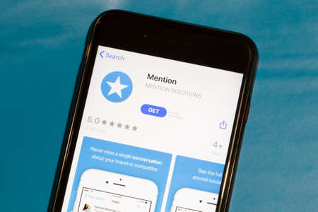 Los Angeles, California, USA - 12 February 2020: Mention app icon on phone screen top view, Illustrative Editorial.のeditorial素材