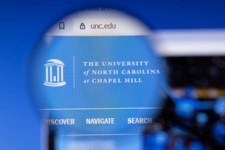 Los Angeles, California, USA - 3 March 2020: University of North Carolina Chapel Hill website homepage logo visible on display screen, Illustrative Editorial.のeditorial素材