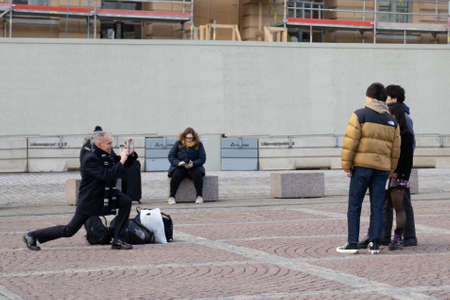 Helsinki, Finland - 3 March 2020: Asian tourists on street, Illustrative Editorial.のeditorial素材