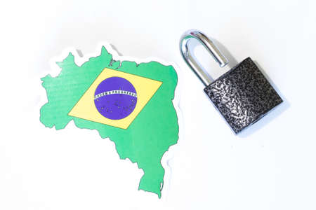 Brasil national flag with outline on white background with open lock top view. The concept of opening the borders of the country.の写真素材