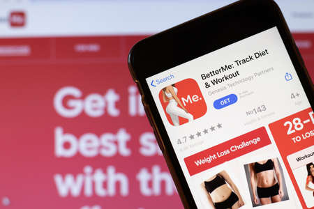 Los Angeles, California, USA - 24 March 2020: BetterME app logo on phone screen close up with website on background with icon, Illustrative Editorialのeditorial素材