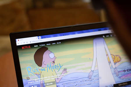 New York, USA - 9 April 2020: Netflix Rick and Morty website on laptop screen close up. Man using service on display, blurry background, Illustrative Editorial.のeditorial素材