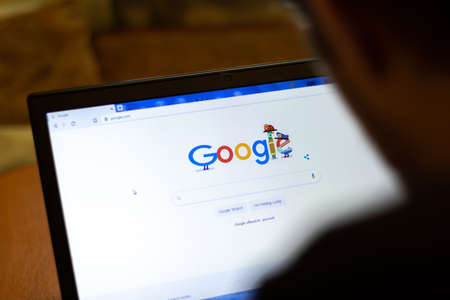 New York, USA - 9 April 2020: Google website on laptop screen close up. Man using service on...