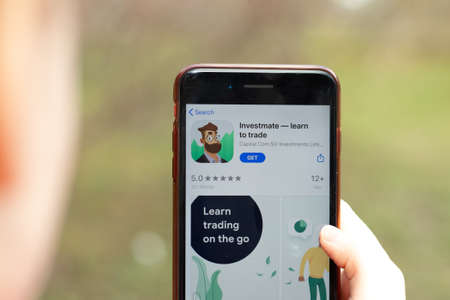 New York, USA - 1 May 2020: Investmate app logo close-up on phone screen, Illustrative Editorial.
